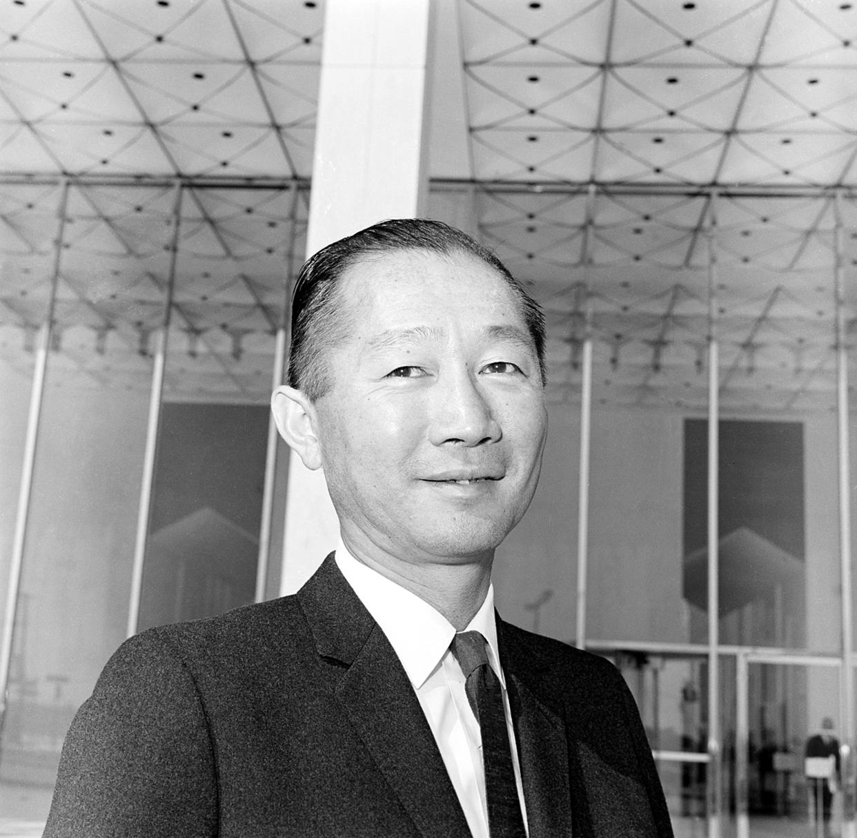 Architect Minoru Yamasaki of Birmingham, Mich., stands in front of the Michigan Consolidated Gas Co., building in Detroit, Mich., on March 23, 1964. (AP)