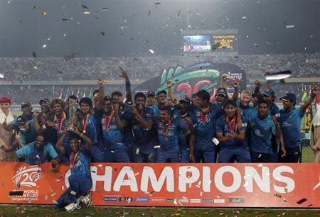 Sri Lanka's players celebrate with the trophy after winning the ICC Twenty20 World Cup cricket title after beating India at the Sher-E-Bangla National Cricket Stadium in Dhaka April 6, 2014. REUTERS/Stringer