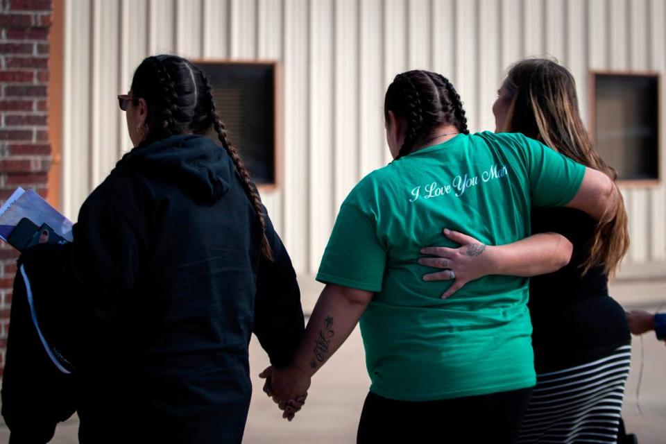 Erica Trevino is supported by family after leaving her son’s funeral and a balloon release to celebrate his life in Waurika, Oklahoma, on Saturday, Jan. 28, 2023. Zechariah Trevino, a 17-year-old Paschal High School junior, was killed in a shooting that injured his cousin outside Whataburger near the Fort Worth school on Jan. 20.