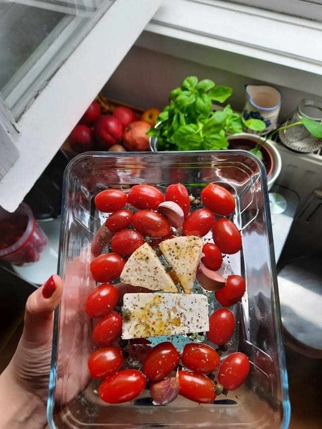 Tomatoes and cheese in a baking dish.