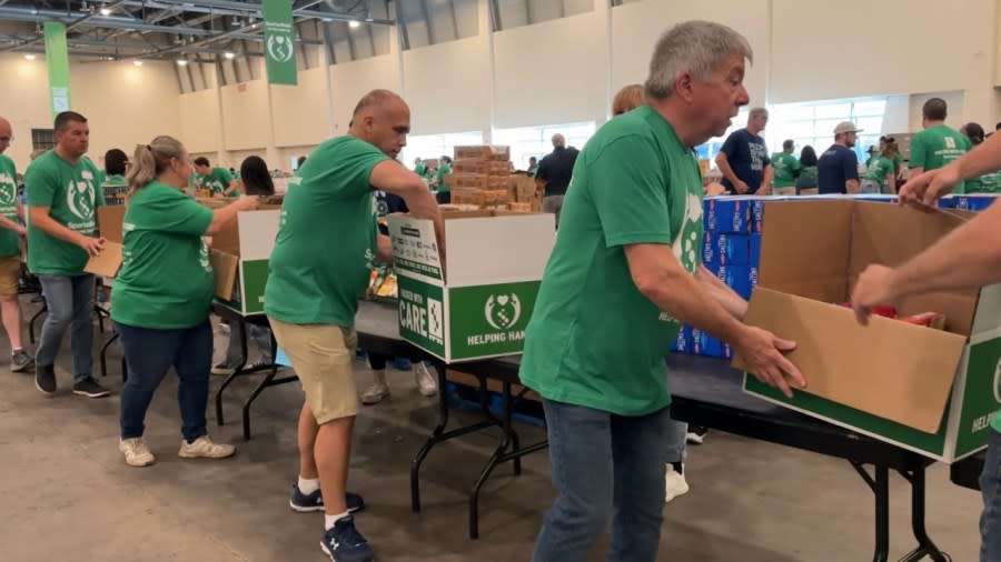 Volunteers packed donations of food on June 6, 2024, for SpartanNash's ninth annual Helping Hands Day.