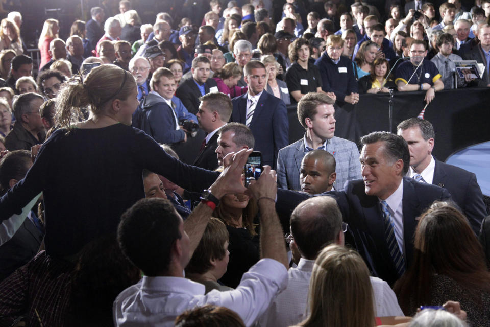 FILE - In this April 24, 2012 file photo, Republican presidential candidate, former Massachusetts Gov. Mitt Romney, right, greets supporters at an election night rally in Manchester, N.H. The world's two biggest economies are entering the final stages of political campaigns to pick their national leaders. While American candidates wage loud, rah-rah campaigns with a clear timetable as they head toward the Nov. 6 presidential election, China hasn’t even announced the date for this fall’s Communist Party congress that will appoint the next top leader to replace outgoing Hu Jintao - a post widely expected to go to Vice President Xi Jinping. (AP Photo/Jae C. Hong, File)