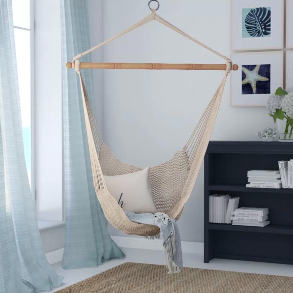 Not only will this add a boho-chic vibe to the room, buit will be the perfect place to relax and finish that book everyone was talking about last year. <br /><br /><strong>Promising review:</strong> "My girls thought these were the coolest chairs ever. We purchased the chairs for them, but they hold me and my husband just as comfortably. <strong>They're perfect for everybody.</strong> I highly recommend them!" &mdash;Lacey<br /><br /><strong>Get it from Wayfair for <a href="https://go.skimresources.com?id=38395X987171&amp;xs=1&amp;url=https%3A%2F%2Fwww.wayfair.com%2Foutdoor%2Fpdp%2Fbeachcrest-home-crowell-chair-hammock-bchh7515.html&amp;xcust=HPHomeMagazine609acebfe4b099ba752f64c2" target="_blank" rel="nofollow noopener noreferrer" data-skimlinks-tracking="5854435" data-vars-affiliate="CJ" data-vars-campaign="SHOPMagazineHomeMower2-2-2021--5854435-/https://www.wayfair.com/outdoor/pdp/beachcrest-home-crowell-chair-hammock-bchh7515.html" data-vars-href="https://www.anrdoezrs.net/links/8209452/type/dlg/sid/SHOPMagazineHomeMower2-2-2021--5854435-/https://www.wayfair.com/outdoor/pdp/beachcrest-home-crowell-chair-hammock-bchh7515.html" data-vars-link-id="16331203" data-vars-price="" data-vars-product-id="20945784" data-vars-product-img="https://secure.img1-fg.wfcdn.com/im/94722356/resize-h800-w800%5Ecompr-r85/4770/47701514/Crowell+Chair+Hammock.jpg" data-vars-product-title="Crowell Chair Hammock" data-vars-redirecturl="https://www.wayfair.com/outdoor/pdp/beachcrest-home-crowell-chair-hammock-bchh7515.html" data-vars-retailers="wayfair" data-ml-dynamic="true" data-ml-dynamic-type="sl" data-orig-url="https://www.anrdoezrs.net/links/8209452/type/dlg/sid/SHOPMagazineHomeMower2-2-2021--5854435-/https://www.wayfair.com/outdoor/pdp/beachcrest-home-crowell-chair-hammock-bchh7515.html" data-ml-id="5">$53.99</a>.</strong>