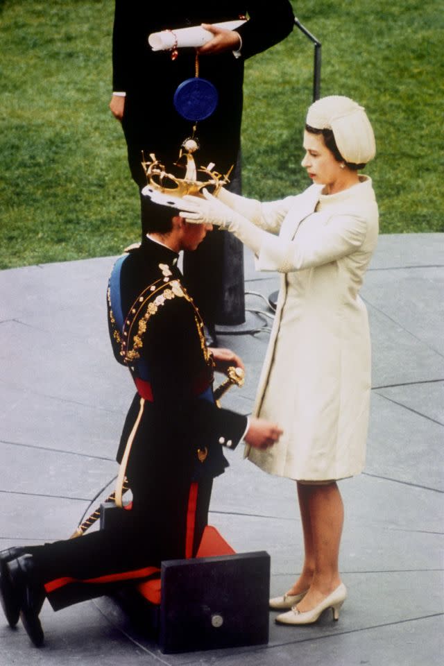 <p>The Queen crowns her son, Prince Charles, as the Prince of Wales, during an investiture ceremony at Caernarfon Castle. (PA Archive) </p>