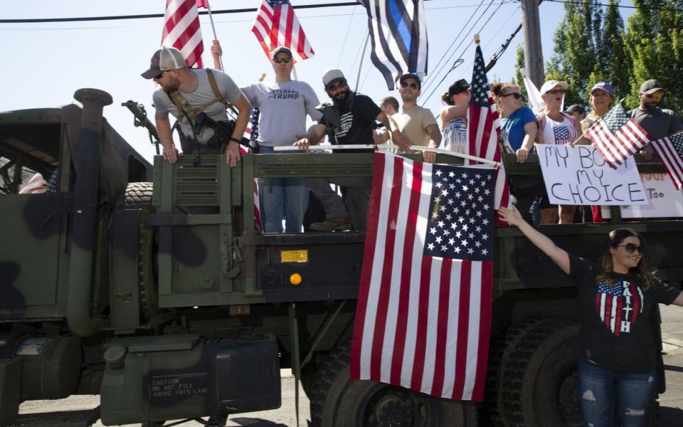 Supporters and members of Patriot Prayer and Peoples Rights Washington rally against the Washington state mask mandate on June 26, 2020 in Vancouver, Washington. Washington state Governor Jay Inslee ordered a statewide mandate requiring facial coverings be worn by anyone out in public beginning today in an effort to slow the spread of coronavirus (COVID-19) which is seeing a rise of cases in the state and across the country. - Karen Ducey/Getty