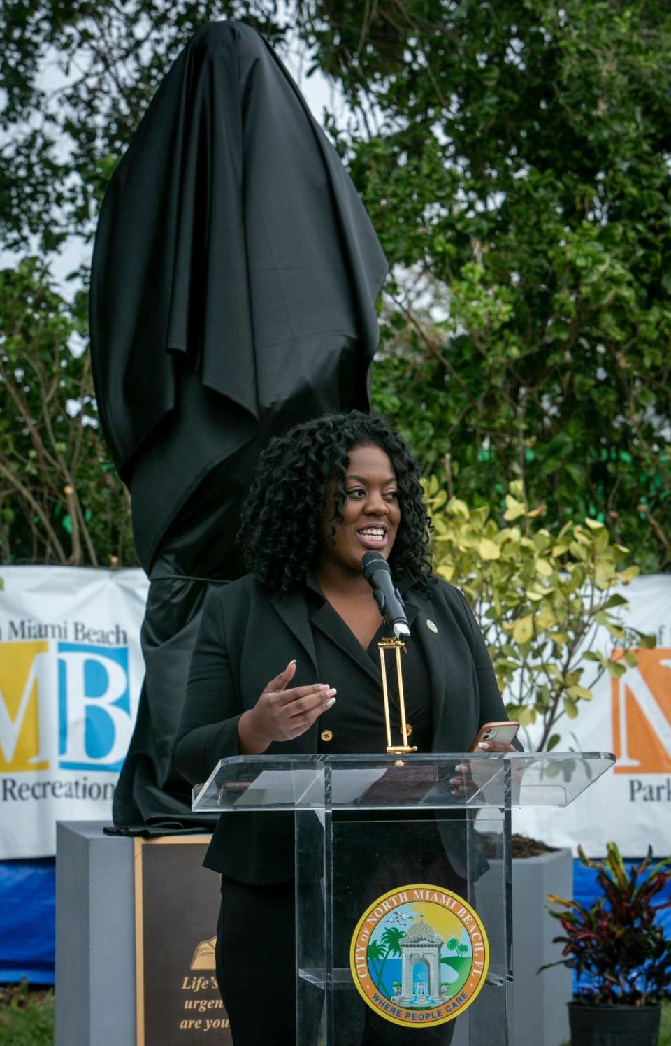 North Miami Beach FL- March 20, 2023 - North Miami Beach Commissioner Daniela Jean speaks to elected officials and residents of Washington Park during an unveiling ceremony at Martin Luther King Linear Park. The city of North Miami Beach unveiled a statue of MLK at MLK Linear Park on 15th court and NE 153rd terrace in North Miami Beach.