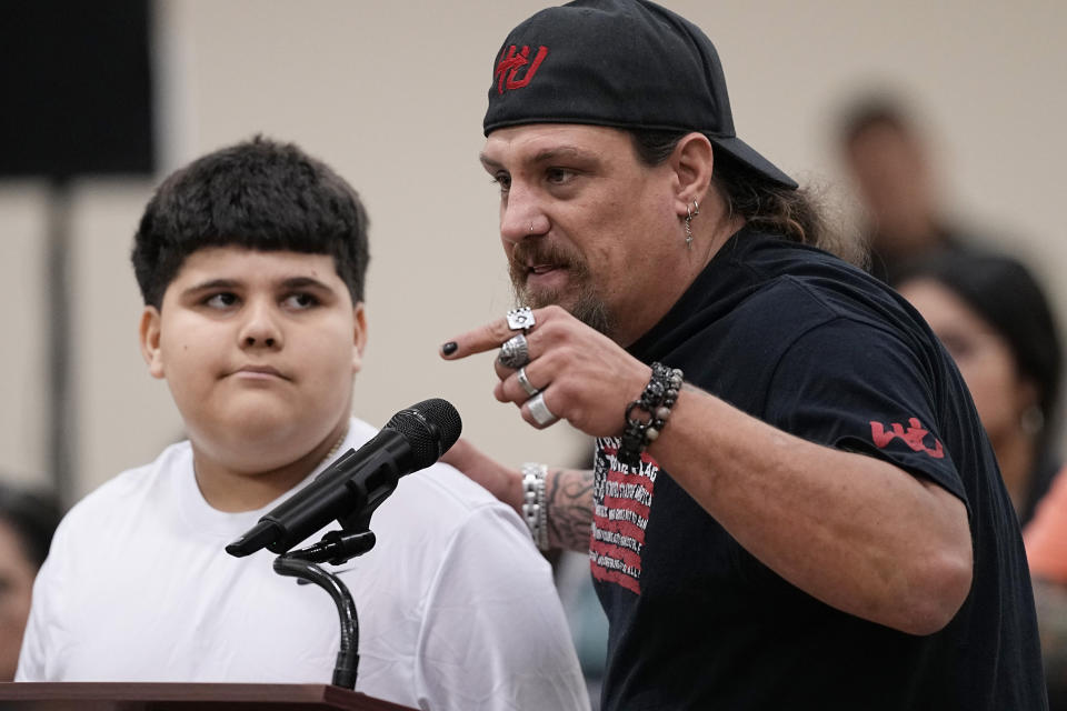 Brett Cross, right, who's son Uziyah Garcia was among 19 children killed in the massacre at Robb Elementary, speaks at a special city council meeting in Uvalde, Texas, Thursday, March 7, 2024. Almost two years after the deadly school shooting in Uvalde that left 19 children and two teachers dead, the city council met to discuss the results of an independent investigation it requested into the response by local police officers. (AP Photo/Eric Gay)