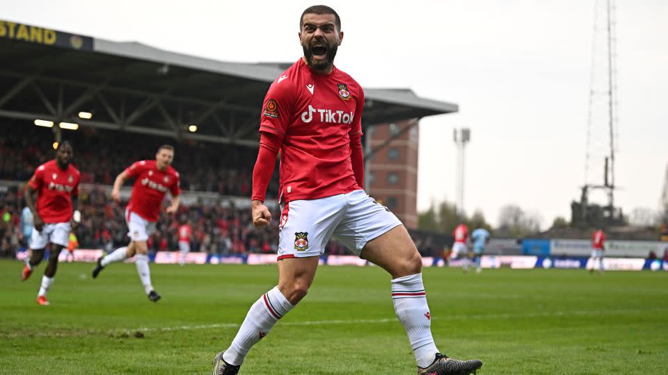 Welcome to Wrexham - striker Elliot Lee celebrates during the match that confirmed his team's promotion to the Football League. - Oli Scarff/AFP via Getty Images