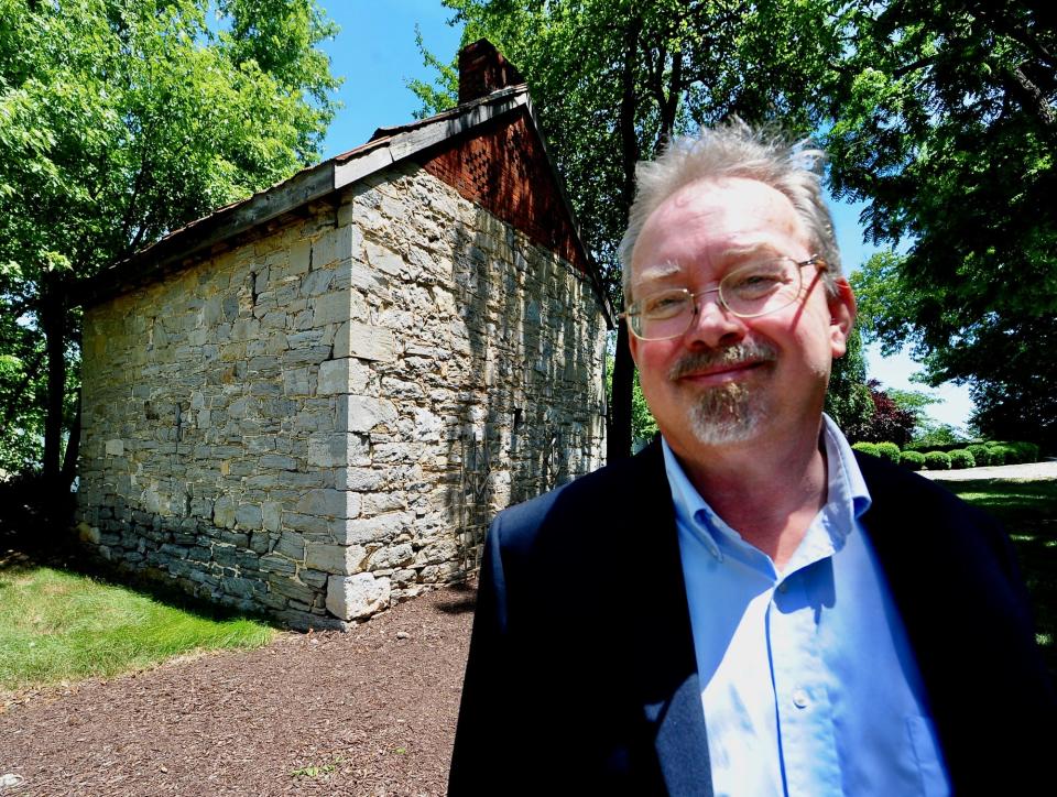 Retired National Park Service historian Dean Herrin stands Sunday outside a blacksmith shop at Rockland Estate where James W.C. Pennington worked before escaping enslavement.