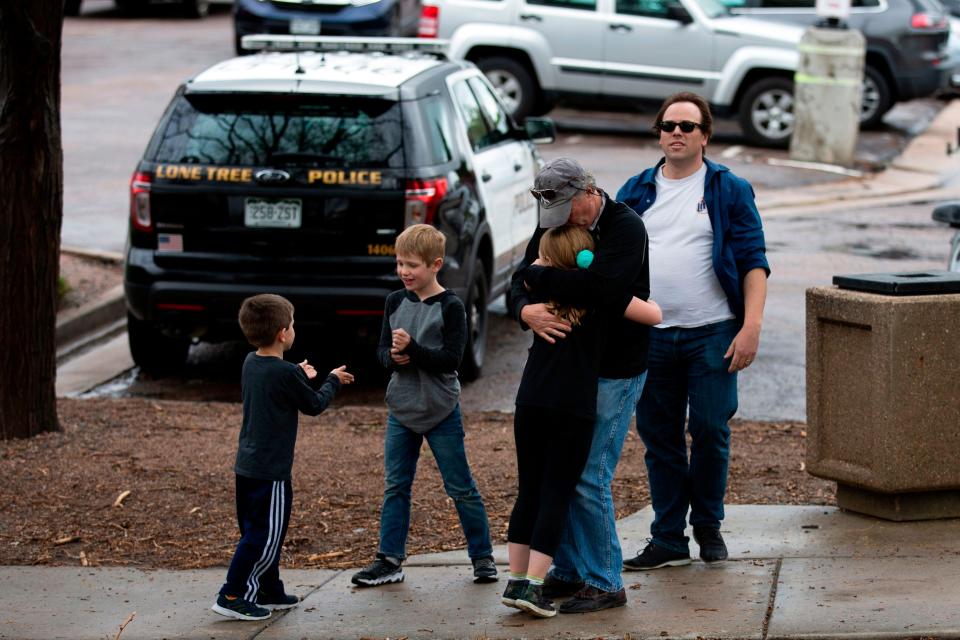 In this file photo taken on May 07, 2019, students are evacuated from the Recreation Center at Northridge in Highlands Ranch after a shooting at the STEM School Highlands Ranch.