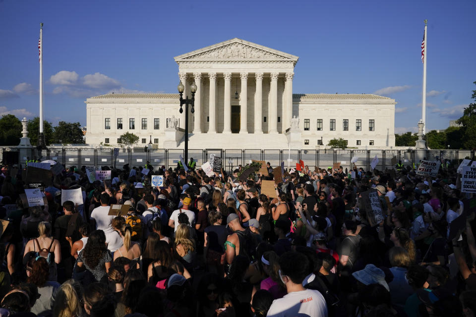 FILE - Protesters fill the street in front of the Supreme Court after the court's decision to overturn Roe v. Wade in Washington, June 24, 2022. Support for abortion rights drove women to the polls in Tuesday’s elections. But for many, the issue took on higher meaning, part of an overarching concern about the future of democracy. Women, especially Democratic women, were more likely than men to say the Roe v. Wade reversal was a top factor in their vote.(AP Photo/Jacquelyn Martin, File)