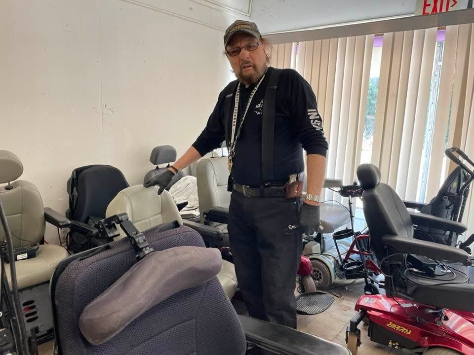 A-Z Pawn owner Phillip Pavone stands in a storage room for motorized wheelchairs. Pavone said he'll be ending the Gift of Mobility charity soon, due to his health and the overwhelming need.