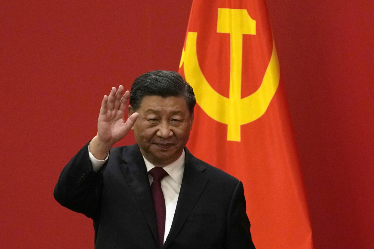 FILE - Chinese President Xi Jinping waves at an event to introduce new members of the Politburo Standing Committee at the Great Hall of the People in Beijing on Oct. 23, 2022. The world faces the prospect of more tension with China over trade, security and human rights after Xi Jinping awarded himself a third five-year term on Oct. 23, 2022 as leader of the ruling Communist Party. (AP Photo/Andy Wong, File)