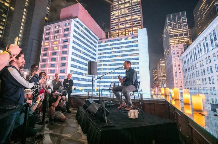 <span class="article__caption">Jack Johnson performs at a private rooftop concert during the NFT.NYC conference. The show gave conference-goers a small taste of the benefits they can expect from the Outerverse Passport. (Photo: Darren Miller)</span>