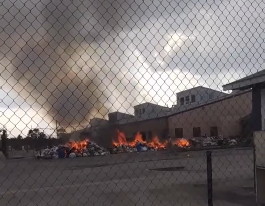 Garbage burns outside Donaldson Correctional Facility on Sunday, June 26, 2022, in Bessemer, Ala.