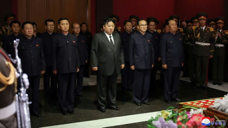 Leader Kim Jong Un (C) and senior officials pay their respects to North Korea's former propaganda chief Kim Ki Nam, who died on Tuesday at the age of 94, KCNA reported (STR)