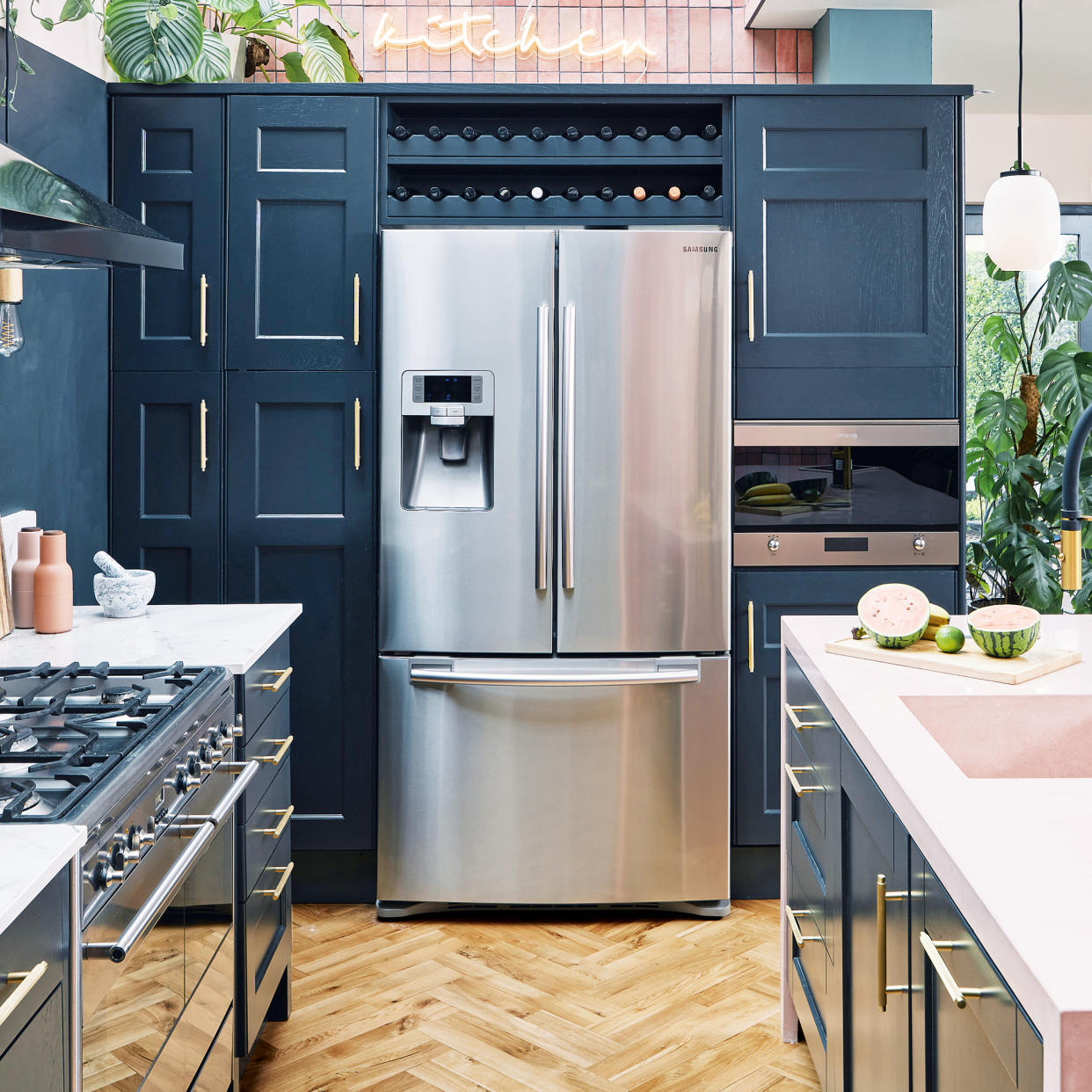  Blue kitchen with island, double fridge freezer and gas hob 