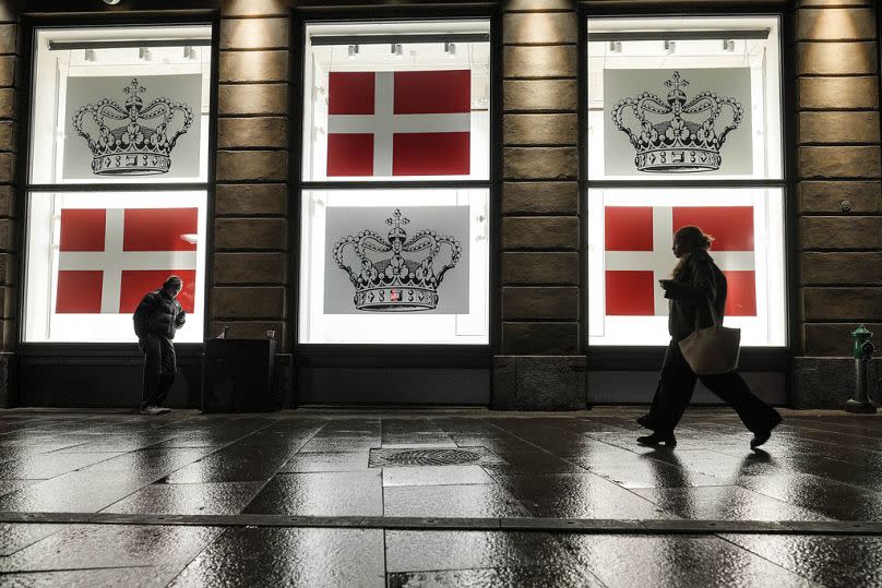 Department store windows display the Danish flag and the Danish crown in Copenhagen, 13 January 2024