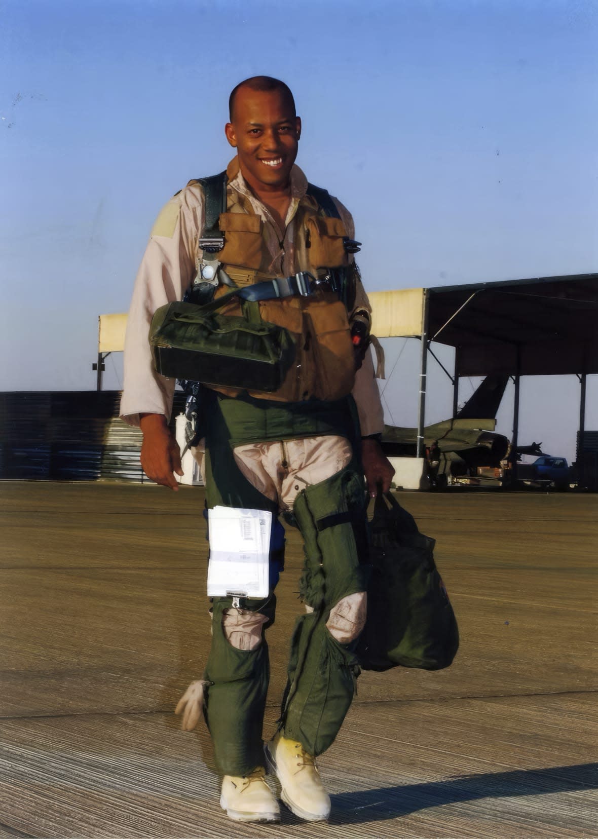 In this image provided by the U.S. Air Force, Lt. Col. CQ Brown, Jr. deployed as an F-16 squadron commander in support of Operation Southern Watch in 2001, walks on the flight line. Brown also deployed or directly supported Operation Northern Watch, Operation Enduring Freedom, Operation Odyssey Dawn and Operation Unified Protector, and Operation Inherent Resolve. President Joe Biden is expected to announce Air Force Gen. CQ Brown Jr., a history-making fighter pilot with recent experience countering China in the Pacific, to serve as the next chairman of the Joint Chiefs of Staff. (U.S. Air Force via AP)