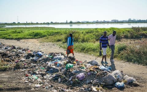 A heap of rubbish dumped next to the sewer ponds in Garden Compund, Lusaka, Zambia, May 2018. - Credit: Chileshe Chanda/WaterAid