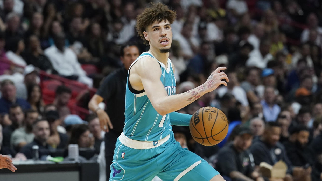 Charlotte Hornets guard LaMelo Ball (1) dribbles the ball during the second half of an NBA basketball game against the Miami Heat Saturday, Nov. 12, 2022, in Miami. (AP Photo/Marta Lavandier)
