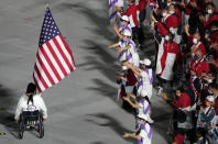 The flag of the United States enters the stadium during the closing ceremony for the 2020 Paralympics at the National Stadium in Tokyo, Sunday, Sept. 5, 2021. (AP Photo/Eugene Hoshiko)