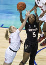 North Carolina State's Jada Boyd, right, and Louisville's Hailey Van Lith, left, battle for a ball during the championship of the Atlantic Coast Conference NCAA women's college basketball game in Greensboro, N.C., Sunday, March 7, 2021. (AP Photo/Ben McKeown)