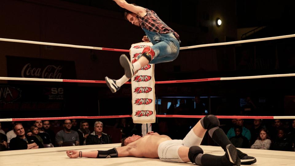 Wrestler Little Hillbilly jumps on Werner 'The Wolf' Pretorius during the Africa Wrestling Alliance Nights of Champions at the Parow Civic Centre in Cape Town in October 2023