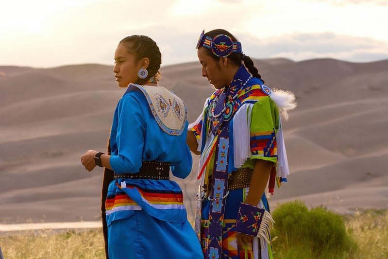 Members of a Jicarilla Apache dance team participated in a cultural event at Great Sand Dunes National Park in July 2019.
