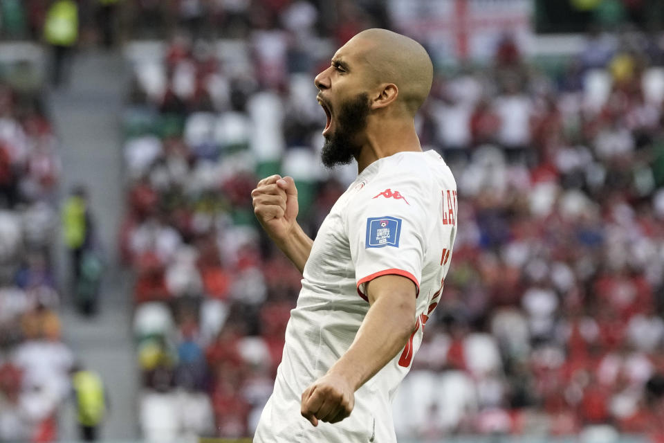 Tunisia's Aissa Laidouni reacts to supporters during the World Cup group D soccer match between Denmark and Tunisia, at the Education City Stadium in Al Rayyan , Qatar, Tuesday, Nov. 22, 2022. (AP Photo/Hassan Ammar)