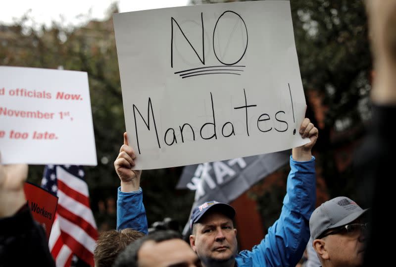 FILE PHOTO: Union firefighters and others protest against vaccine mandates in New York City