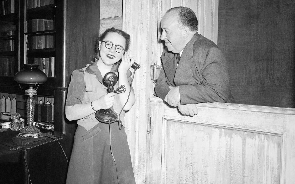 Pat and her father Alfred Hitchcock in 1944 during rehearsal for the play Violet - Bettmann