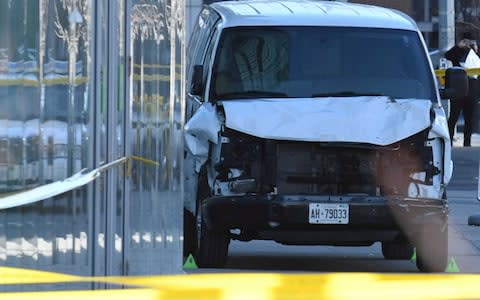 A damaged van that struck multiple people in Toronto - Credit: Reuters