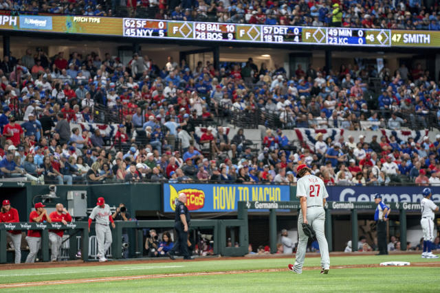 Texas Rangers catcher Jonah Heim throws the ball back to the pitcher during  an opening day baseball game against the Philadelphia Phillies Thursday,  March 30, 2023, in Arlington, Texas. (AP Photo/Jeffrey McWhorter