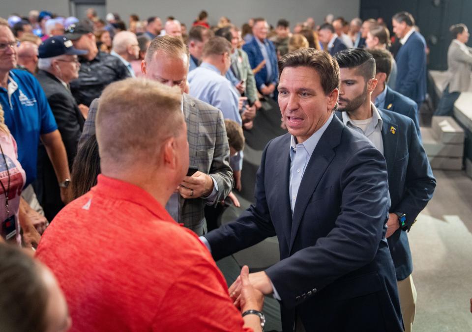 Republican presidential candidate Florida Gov. Ron DeSantis greets audience members after a campaign event in Clive, Tuesday, May 30, 2023. 