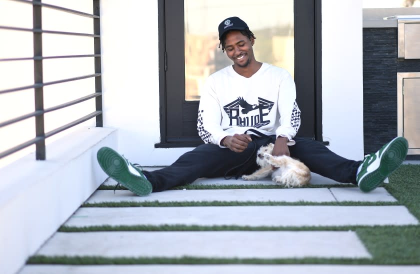 VENICE, CALIFORNIA MAY 21, 2020-NBA player Moe Harkless spends time at home with his dog in Venice as he awaits the restart of the NBA season. (Wally Skalij/Los Angeles Times)