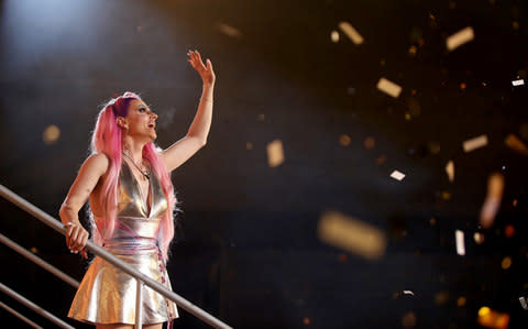 Courtney Act celebrates winning the reality TV show - Credit: Wireimage