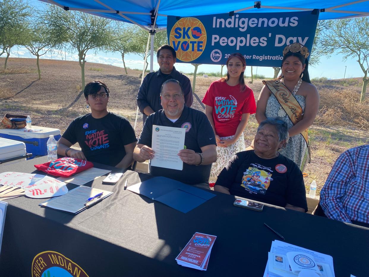 Gila River Indian Community Gov. Stephen Roe Lewis displays a proclamation naming Oct. 10, 2023 as Porter and Johnson Day to commemorate the two community members who first sued for the Native right to vote in Arizona during a voter registration event on Oct. 10, 2022.