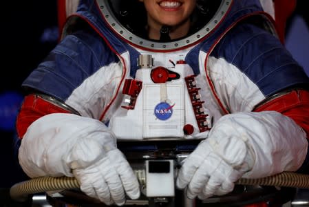 Advanced Space Suit Engineer at NASA Kristine Davis wears the xEMU space suit for the next astronaut to the moon by 2024, during its presentation at NASA headquarters in Washington