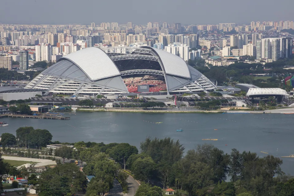 The Singapore Sports Hub seen with the Kallang River in the foreground.