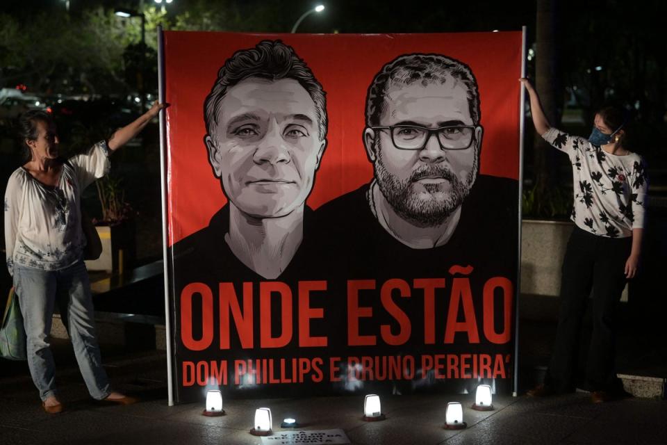 Employees of the National Indigenous Foundation protest over the missing men in Brazil (AFP via Getty Images)