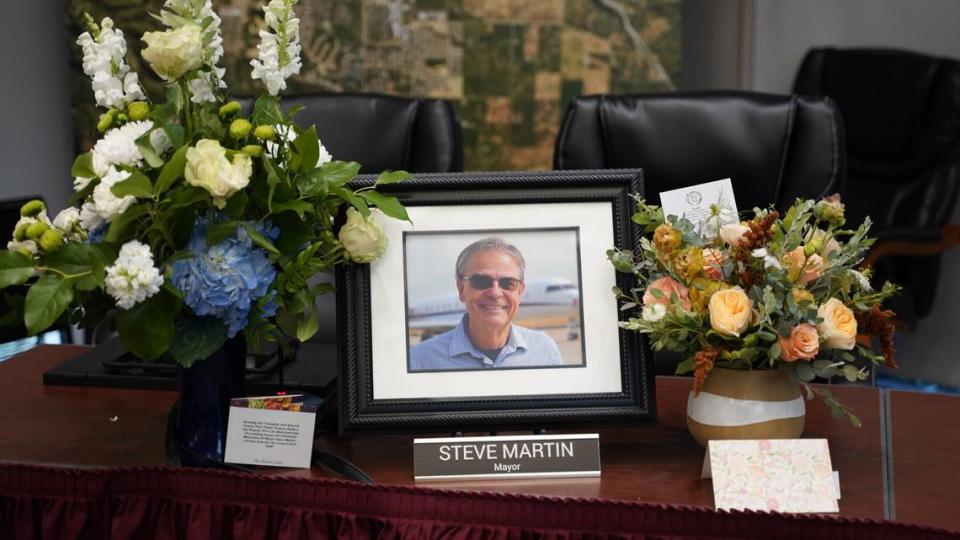 A picture of Mayor Steve Martin and flowers sat at his spot on the dais at the Paso Robles City Council meeting the day after his death due to cancer.