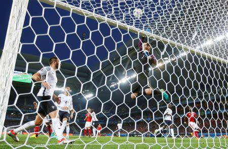 Football Soccer - Switzerland v France - EURO 2016 - Group A - Stade Pierre Mauroy, Lille, France - 19/6/16 France goalie Hugo Lloris tips the ball over the bar. France's Andre-Pierre Gignac. REUTERS/Carl Recine