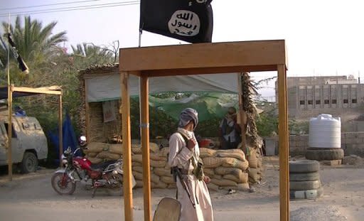 Suspected Al-Qaeda militants man a checkpoint in the area of Azzan in the southern Yemeni province of Shabwa in April 2012. The double agent who infiltrated Al-Qaeda and helped foil a plot to blow up a US-bound airliner held a British passport in addition to being a Saudi national, CNN reported