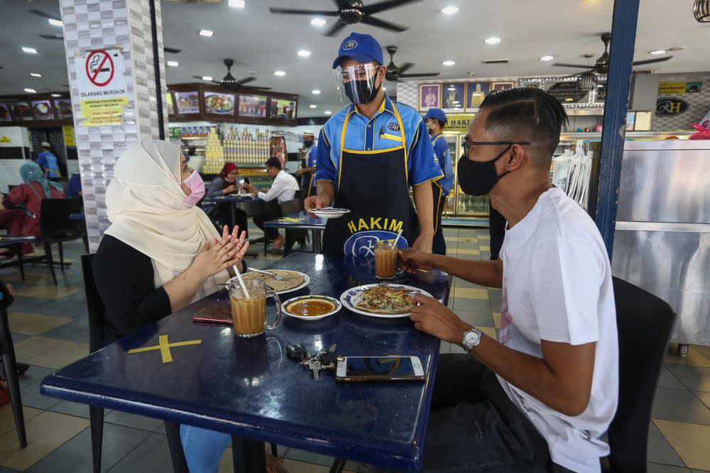 Patrons are seen dining in at Hakim Restaurant in Shah Alam February 10, 2021. — Picture by Yusof Mat Isa