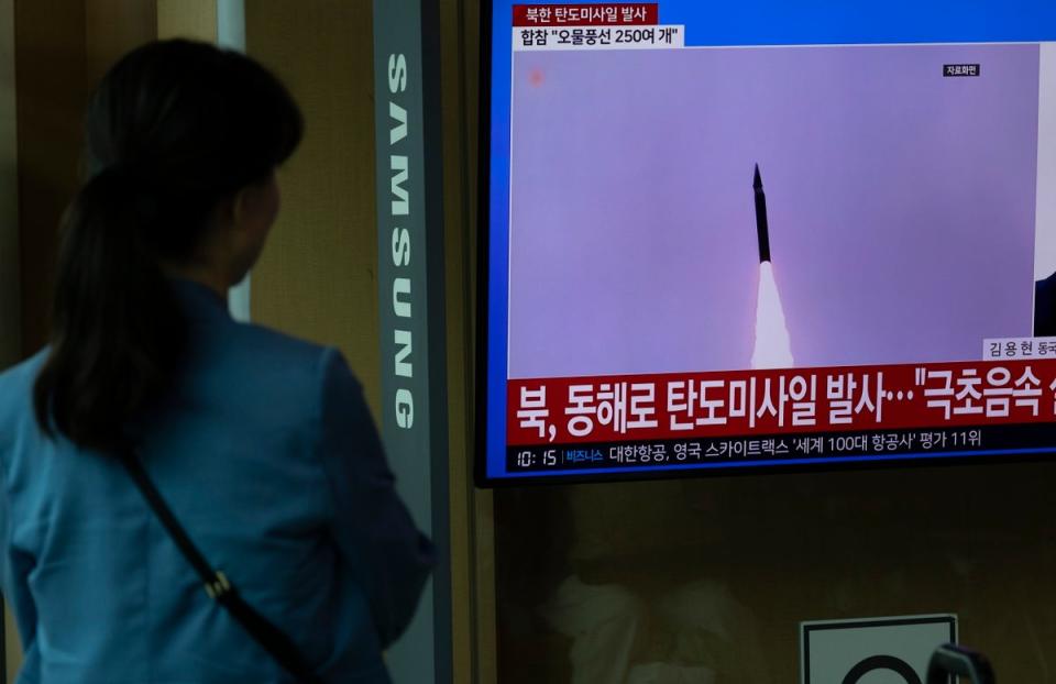 People watch the news at a station in Seoul, South Korea, 26 June 2024 (EPA)