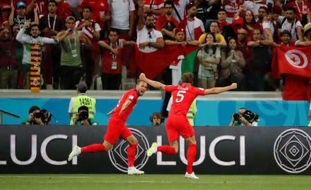 Soccer Football - World Cup - Group G - Tunisia vs England - Volgograd Arena, Volgograd, Russia - June 18, 2018 England's Harry Kane celebrates scoring their first goal with John Stones REUTERS/Jorge Silva