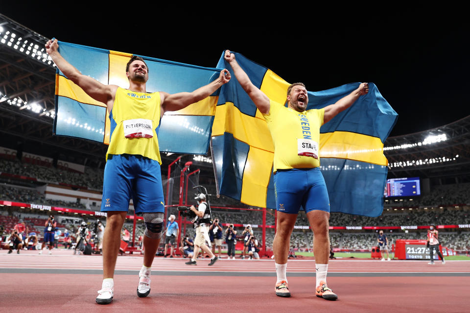 <p>TOKYO, JAPAN - JULY 31: Daniel Stahl of Team Sweden and Simon Pettersson of Team Sweden celebrate after winning the gold and silver medal in Men's Discus Throw Final on day eight of the Tokyo 2020 Olympic Games at Olympic Stadium on July 31, 2021 in Tokyo, Japan. (Photo by Maja Hitij/Getty Images)</p> 