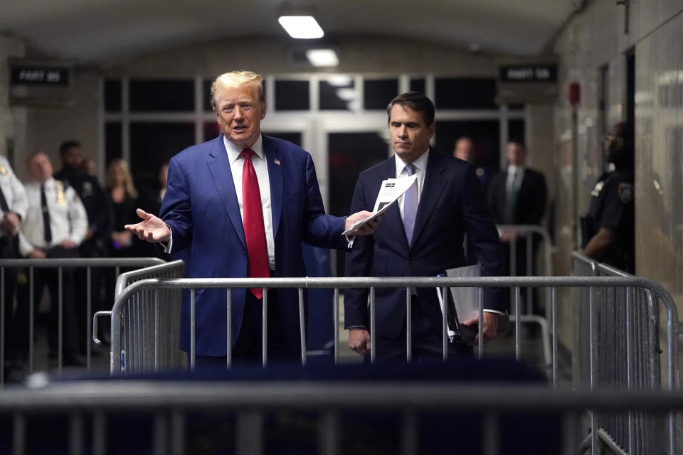 Former President Donald Trump, with attorney Todd Blanche, right, arrives at Manhattan criminal court in New York, on Friday, May 10, 2024. (Timothy A. Clary/Pool Photo via AP)