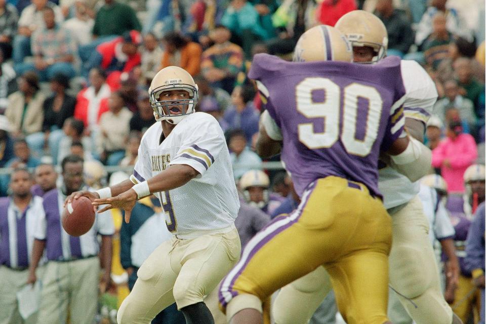 FILE - In this Oct. 15, 1994, file photo, Alcorn State quarterback Steve McNair looks for a receiver during an during an NCAA college football game against Prairie View in Houston. Eric Dickerson from SMU, Heisman Trophy winner Eric Crouch from Nebraska and the late Steve McNair from Alcorn State are among 17 players selected for induction into the College Football Hall of Fame on Wednesday, March 11, 2020. (AP Photo/Tim Johnson, File)